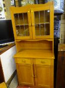 Compact modern light wood dresser with upper leaded glass doors