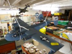 Nine completed model aircraft (displayed hanging)