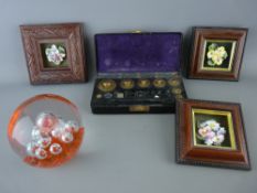 Bakelite cased part set of vintage weights, three framed porcelain floral studies and a decorative