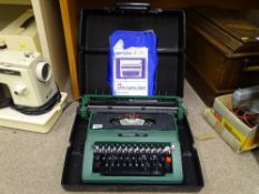 Cased Silver Reed green coloured typewriter