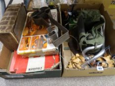 Two boxes of mixed items including an old Bible, board games, fishing reel etc