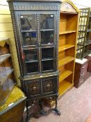 Ornate polished corner cupboard with beadwork carving