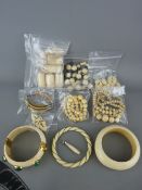 Collection of bone simulated ivory and other items of jewellery and buttons including a yellow metal