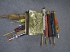 Repousse brass magazine holder and a large quantity of Oriental paper parasols