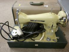 Cased Lucia pedal operated sewing machine