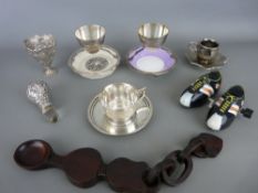 Carved wooden lovespoon, a hallmarked silver decanter stopper, two plated eggcups by Hukin & Heath