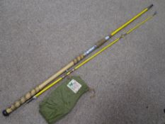 Vintage fishing rod in a canvas case with label for 'M Lee & Son of Redditch'