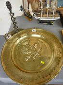 Thistle decorated brass charger and a pewter twist stem table lamp