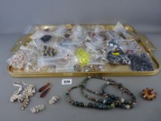 Good tray of costume jewellery including an uranium glass type necklace, fancy brooches and other