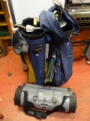 JVC tubular shaped ghetto blaster with carry strap and two golf bags with contents