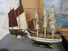 Three model sailing boats