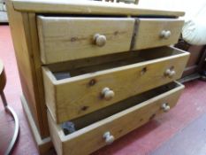 Weathered pine chest of two long and two short drawers
