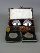 Cased set of Chinese iron balls and a small selection of commemorative coins etc