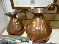 Two gallon and one gallon vintage copper measuring jugs