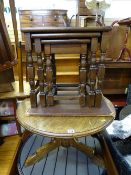 Oak circular tripod occasional table and a polished wood nest of three tables