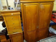 Modern bedroom suite comprising two door wardrobe, two matching four drawer chests and another