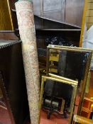 Two gilt framed dressing mirrors, a wooden framed bevelled edged mirror and a rug