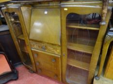 Side by side display cabinet with a central bureau over four base drawers