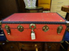 Red metal banded travel trunk