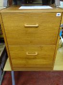 Teak style two drawer filing cabinet and a modern light wood desk with metal legs