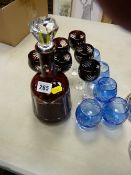 Overlaid glass decanter and drinking glasses
