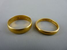 Wide twenty two carat gold wedding band, 3.9 grms and a narrow twenty two carat gold wedding band,