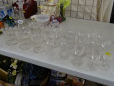 Good parcel of etched Champagne glasses, an etched decanter with stopper and other quality