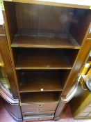 Four shelf bookcase with four lower drawer compartments and brass swing handles
