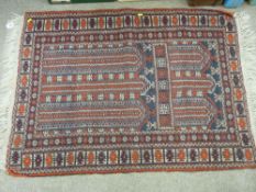 Tassel ended rust coloured Eastern rug 88 x 130 cms