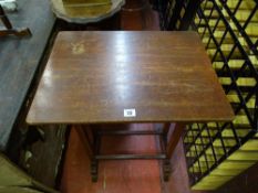 Polished wood occasional table with twin stretcher and a leather tooled top oval occasional table