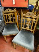 Four non-matching dining chairs with matching upholstery