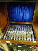 Mahogany canteen of silver handled dessert knives and forks