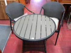Rattan garden table and two matching tubular framed chairs