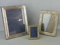 Two silver portrait frames and one other