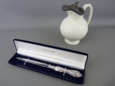 Cased silver handled letter opener by Brookes Jewellers and a pewter lidded water jug