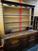 An antique oak Welsh dresser with a cupboard and drawer base, 213cms high Condition reports provided
