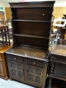 A Priory or type linen-fold narrow dresser with a base of two cupboards and two drawers, 88cms