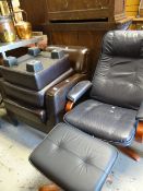 A modern blue leather armchair and matching stool together with a chocolate brown leather armchair