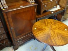 A reproduction mahogany effect TV cabinet and similar style reproduction circular top table with