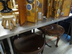 A metal commercial-kitchen preparation table with rail top, 202cms wide Condition reports provided