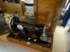 A vintage cased Singer sewing machine Condition reports provided on request by email for this