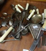 Tray of assorted plated cutlery including slices, various spoons and knives Condition reports