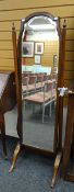 An antique reproduction cheval mirror with shaped glass, 156cms high Condition reports provided on
