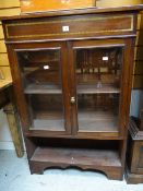 A vintage painted mahogany two-door glazed bookcase with lower open shelf Condition reports provided