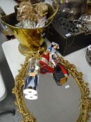 A brass helmet coal scuttle, ornate mirror, collector's dolls Condition reports provided on