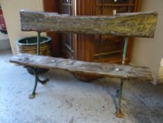 A two-plank and cast iron garden bench Condition reports provided on request by email for this