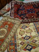An excellent parcel of five various patterned Persian woollen rugs Condition reports provided on