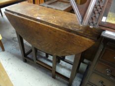 A nineteenth century oak drop leaf gate-leg table of small proportions, 88cms wide x 71cms high