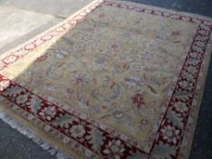 Good quality gold floral and red bordered woollen rug with fringe ends, 244 x 305cms Condition