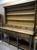 A twentieth century Welsh-type dresser having a configuration of four drawers to the base, six spice